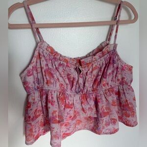 Cropped pink top with bow in front and butterflies
